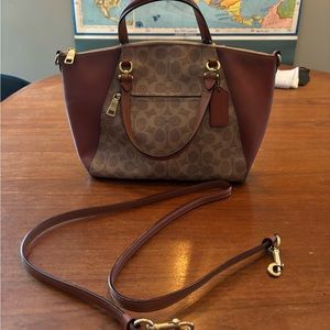 Coach signature canvas and leather handbag with crossover body strap.